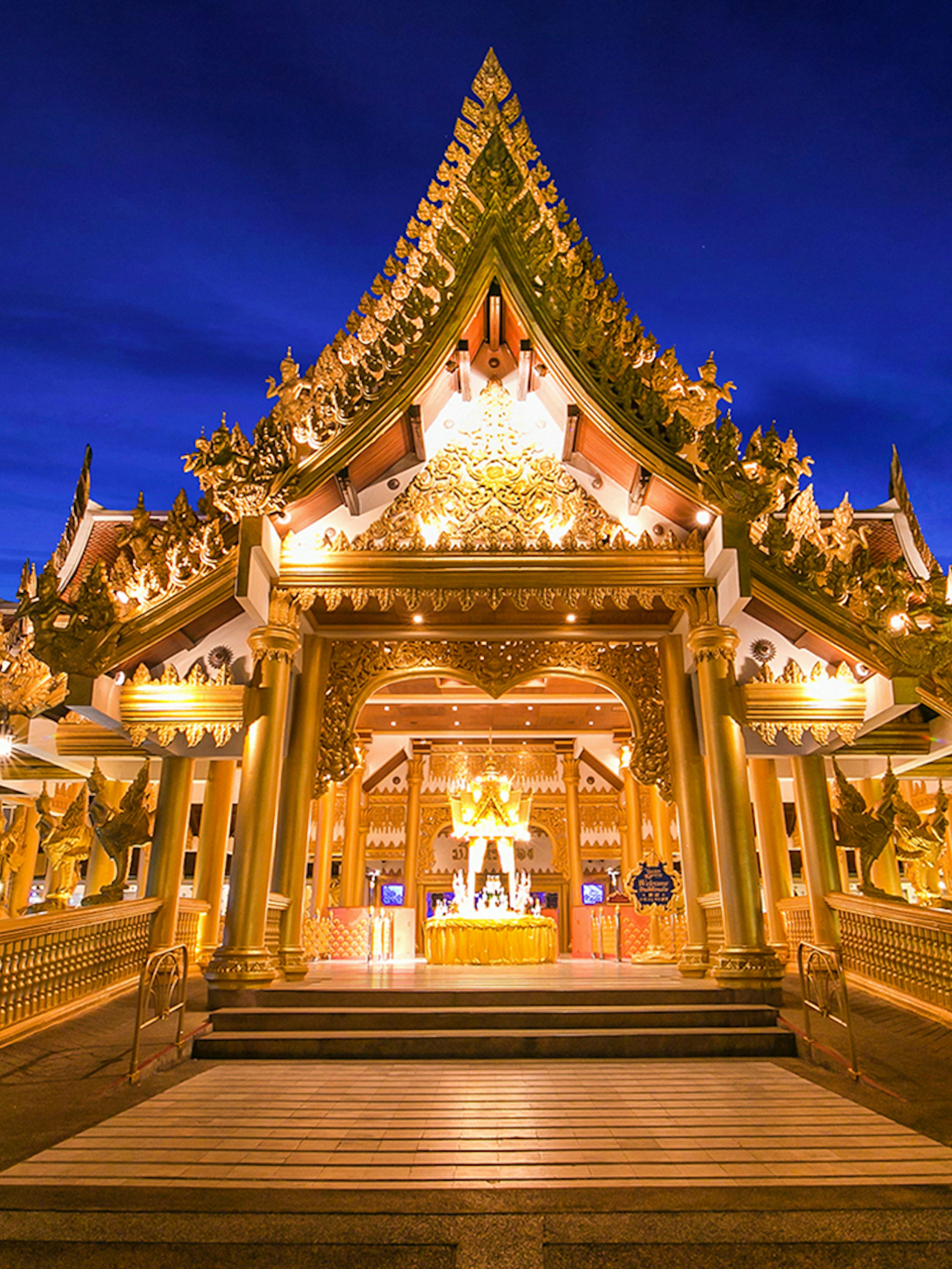 Phuket Fantasea entrance with ornate golden architecture at night.