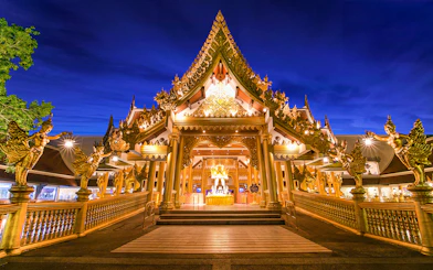 Phuket Fantasea entrance with ornate golden architecture at night.