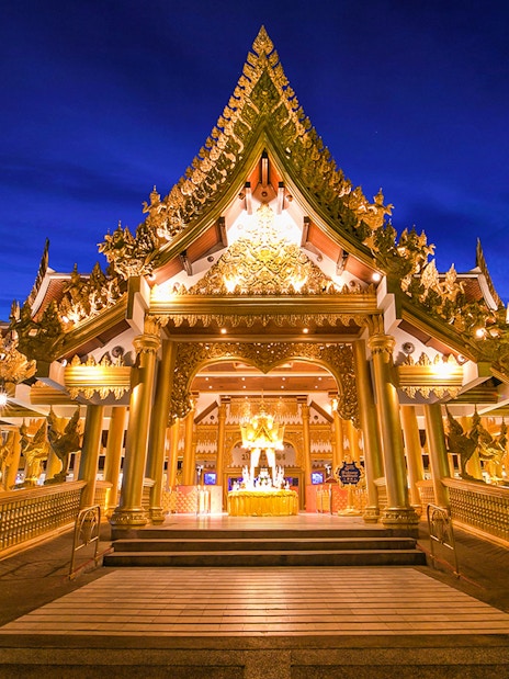 Phuket Fantasea entrance with ornate golden architecture at night.