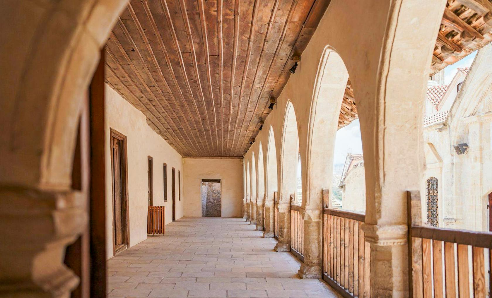 Stone corridor with arches in a Troodos Mountains village, Cyprus.