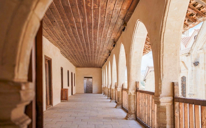Stone corridor with arches in a Troodos Mountains village, Cyprus.