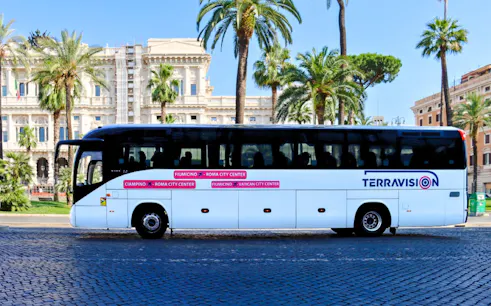 Terravision bus at Fiumicino Airport with Rome city center backdrop.