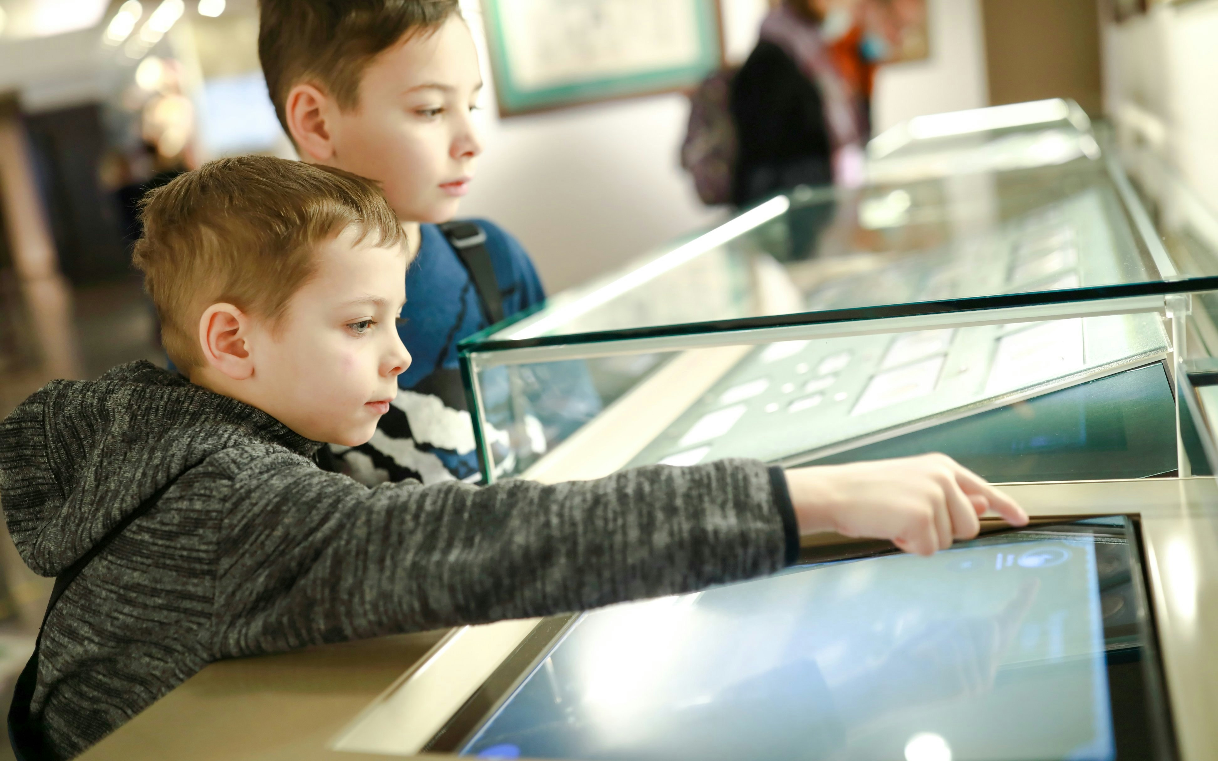 Children interacting with a  exhibit