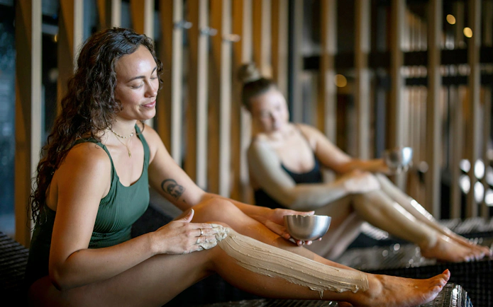 Guests applying geothermal mud at Wai Ariki Hot Springs & Spa, Rotorua.