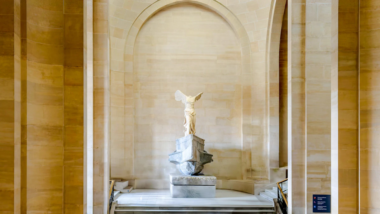 Winged Victory of Samothrace statue on Daru staircase, Louvre Museum, Paris.