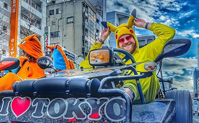 Go-kart riders in character costumes on Tokyo street during Skytree 1-hour tour.