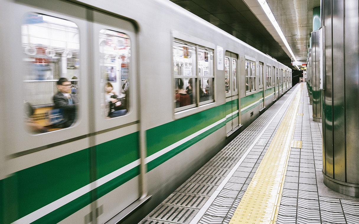 Train arriving at a platform in Kansai, Japan, for JR-West Kansai Rail Pass holders.