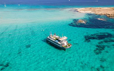 Cruise ship on turquoise waters between Ibiza and Formentera.