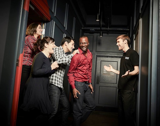 Group of friends enjoying Jack The Ripper Escape Room in Dubai.