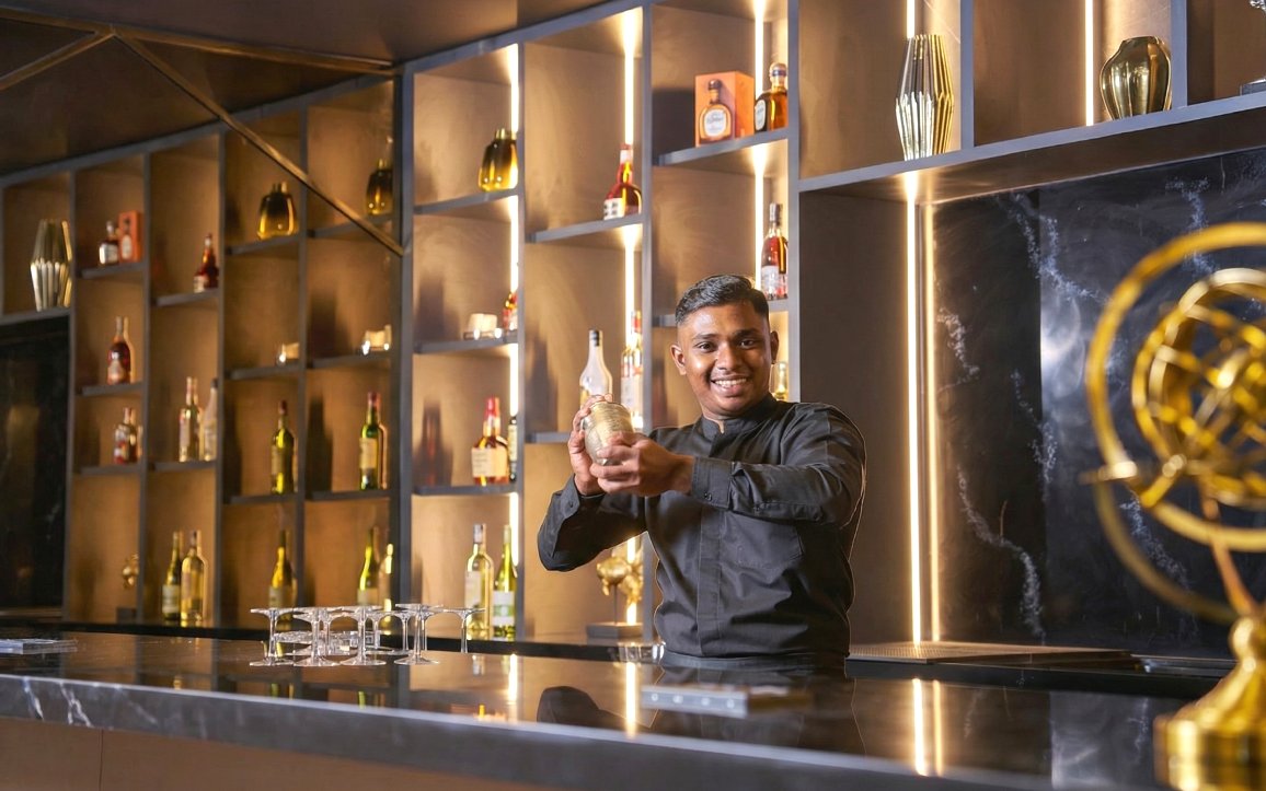 Bartender preparing a drink at Sky Suite Airport Lounge, Terminal 1 & 2.