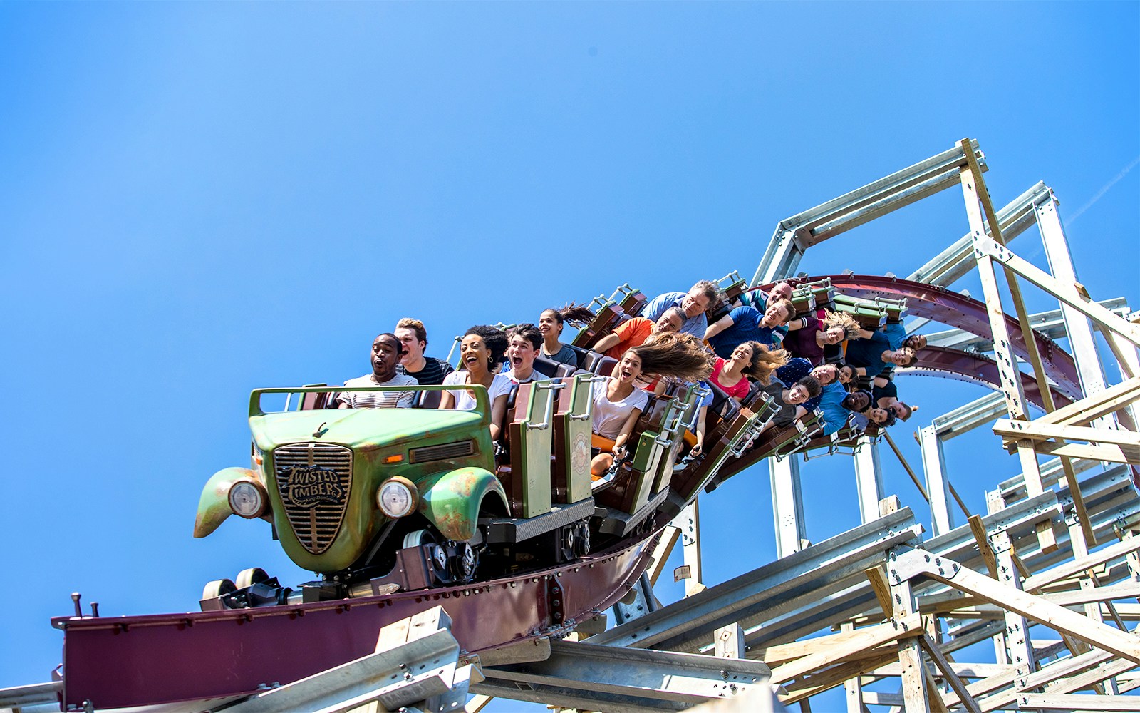 Riders on Twisted Timbers roller coaster at Six Flags King's Dominion.
