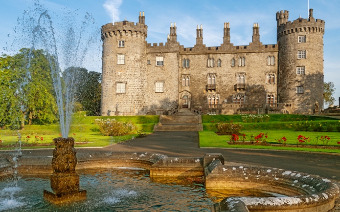 Kilkenny Castle with fountain and gardens in Kilkenny, Ireland.