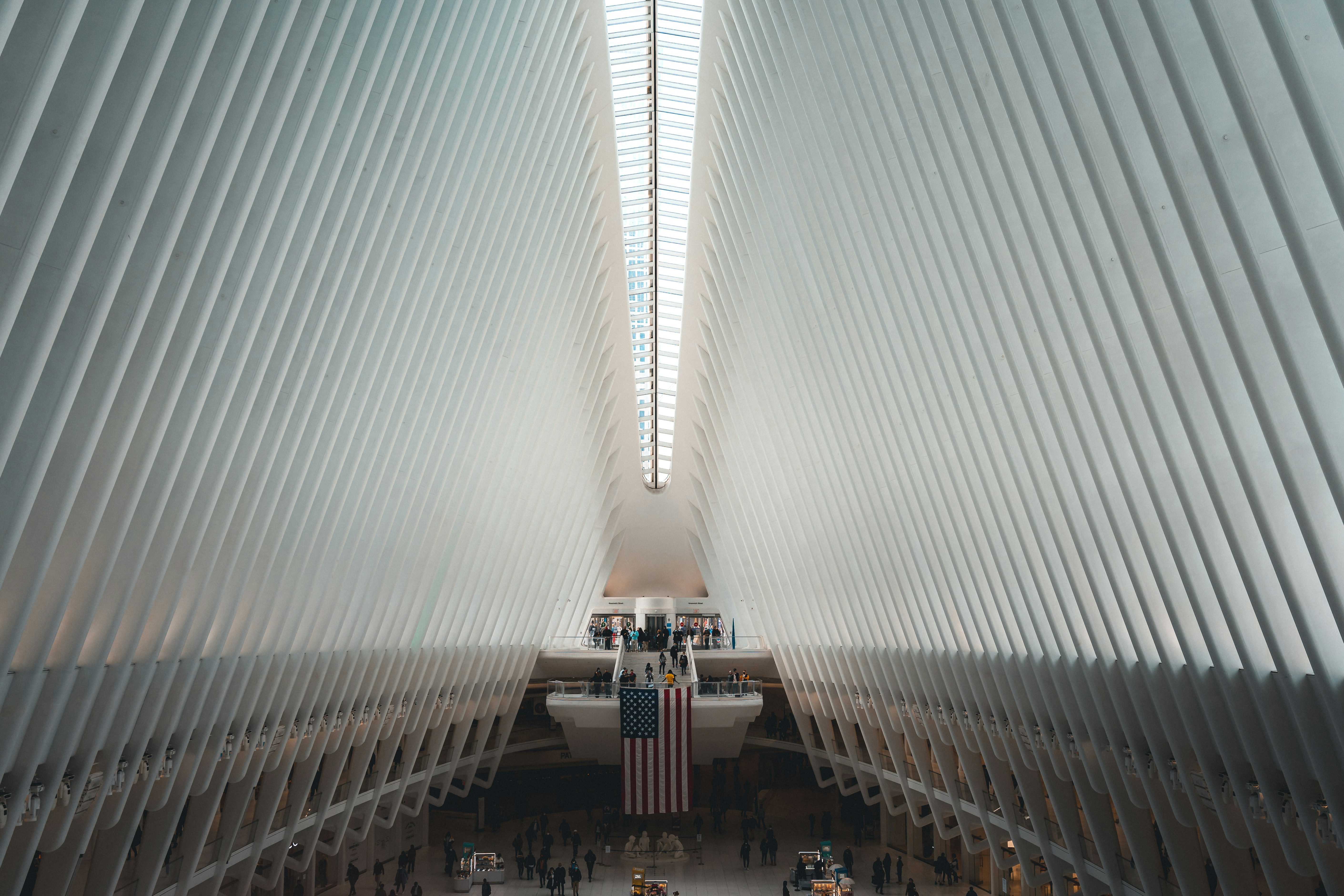Interior view of The Oculus in New York City, showcasing its striking architectural design and skylight.