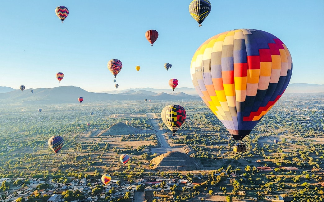 Hot air balloons over Teotihuacan pyramids near Mexico City.