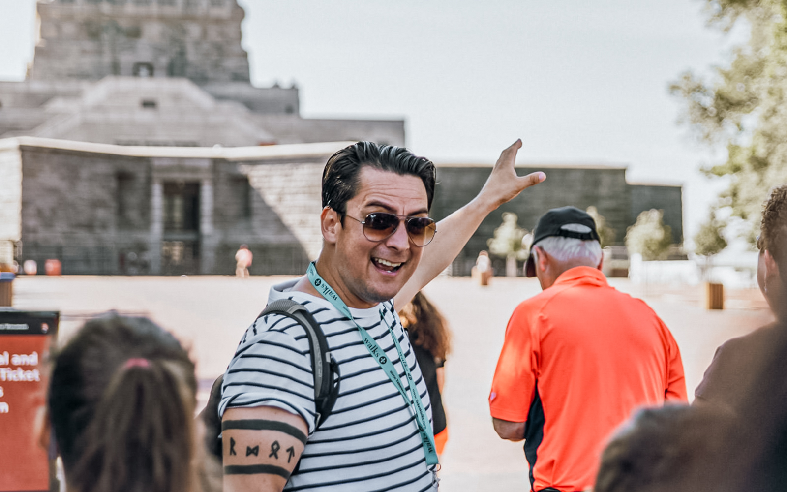 Tour guide leading a group at the Statue of Liberty, New York City.