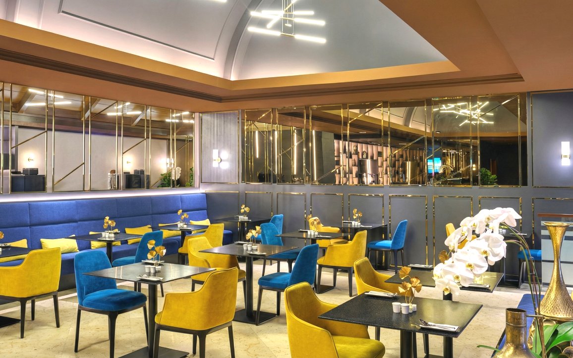 Premium Sky Suite Airport Lounge with seating, elegant decor, and amenities in Terminal 1 & 2.