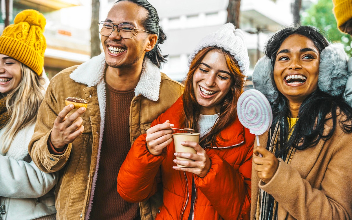 Guests enjoying hot chocolate and Gluhwein during a festive tour.