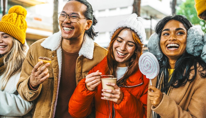 Guests enjoying hot chocolate and Gluhwein during a festive tour.