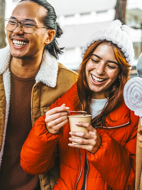 Guests enjoying hot chocolate and Gluhwein during a festive tour.