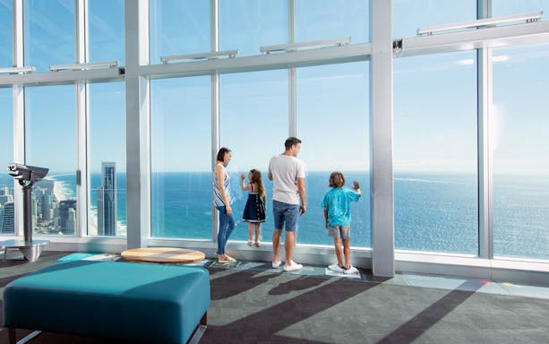 Visitors enjoying ocean views from SkyPoint Observation Deck, Gold Coast.