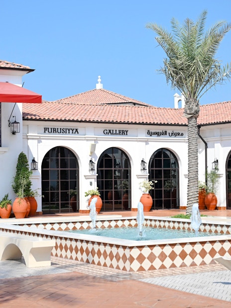 Furusiyya Gallery entrance with fountain, Abu Dhabi Royal Equestrian Arts tour.