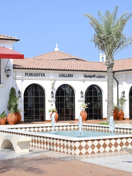 Furusiyya Gallery entrance with fountain, Abu Dhabi Royal Equestrian Arts tour.