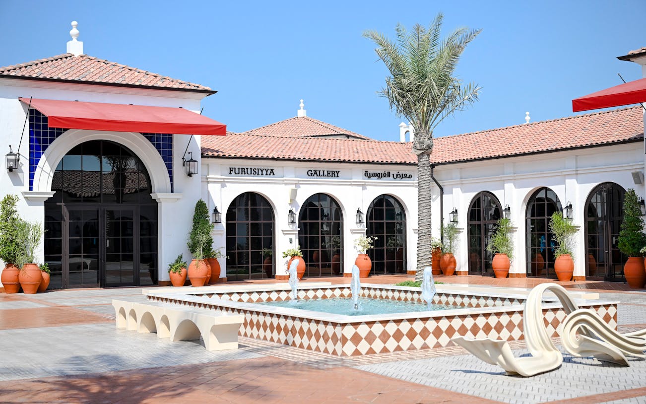 Furusiyya Gallery entrance with fountain, Abu Dhabi Royal Equestrian Arts tour.