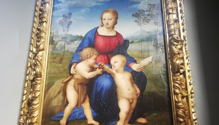Raphael's "Madonna of the Goldfinch" painting featuring Mary, Jesus, and John the Baptist.