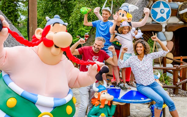 Visitors enjoying character meet-and-greet at Astérix Park, France.