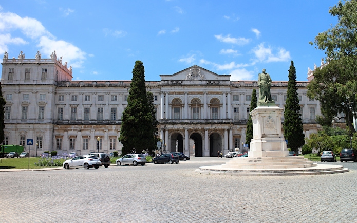 National Palace of Ajuda facade with statue in Lisbon, Portugal.