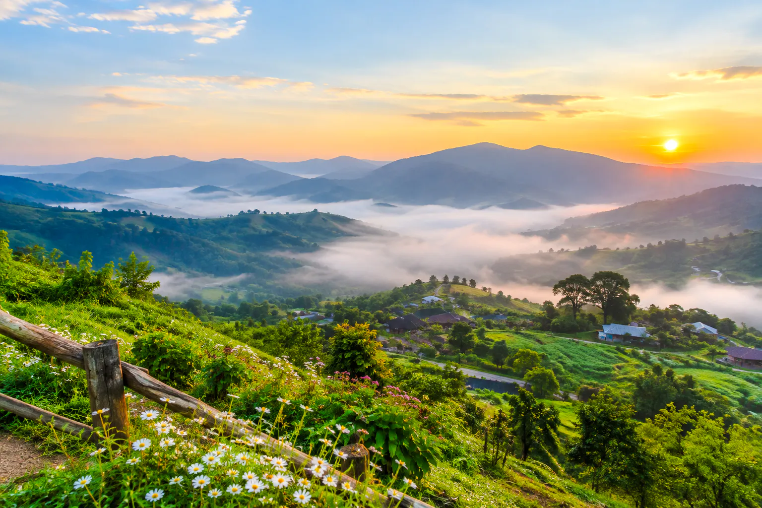 Scenic view of misty mountains and sunrise on the route from Chiang Mai to Mae Hong Son.