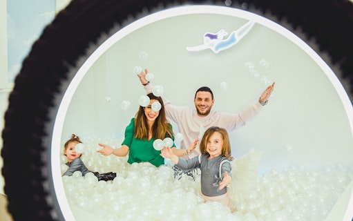 Family enjoying interactive exhibit at Thessaloniki Selfie Museum.