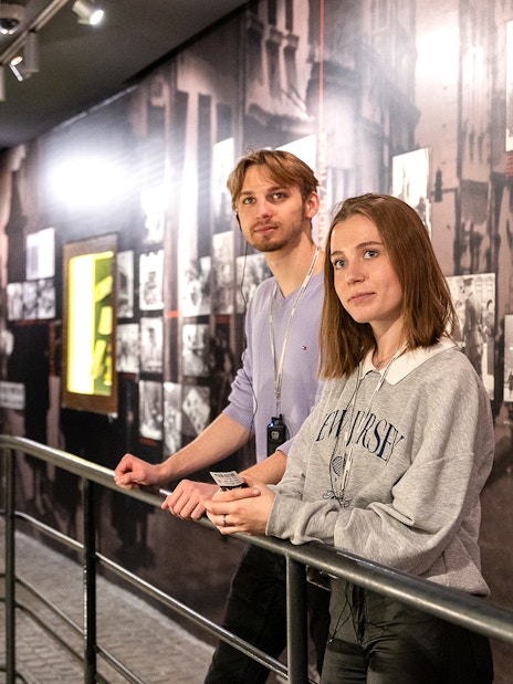 Couple exploring exhibits inside Oskar Schindler's Factory, Krakow.