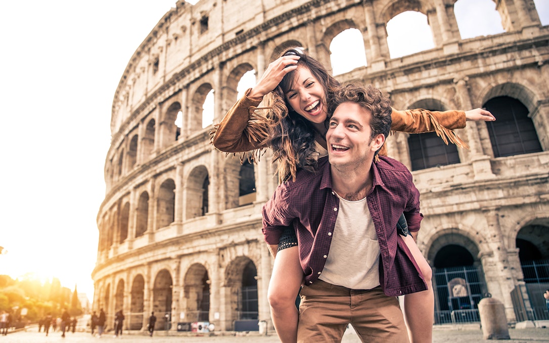Couple enjoying E-Bike Guided Tour near the Colosseum, Rome.