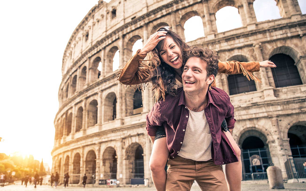 Couple enjoying E-Bike Guided Tour near the Colosseum, Rome.