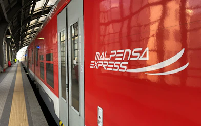 Malpensa Express train at Milan central station platform.