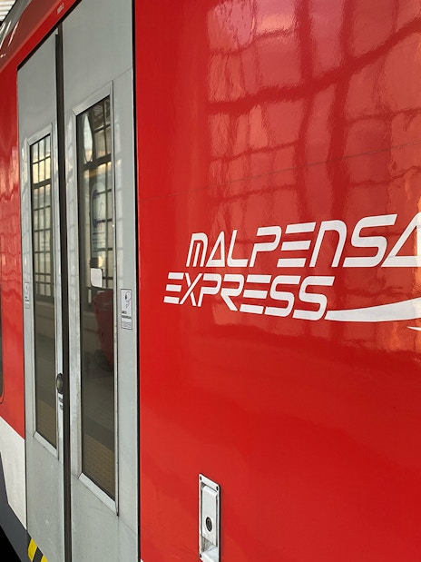 Malpensa Express train at Milan central station platform.