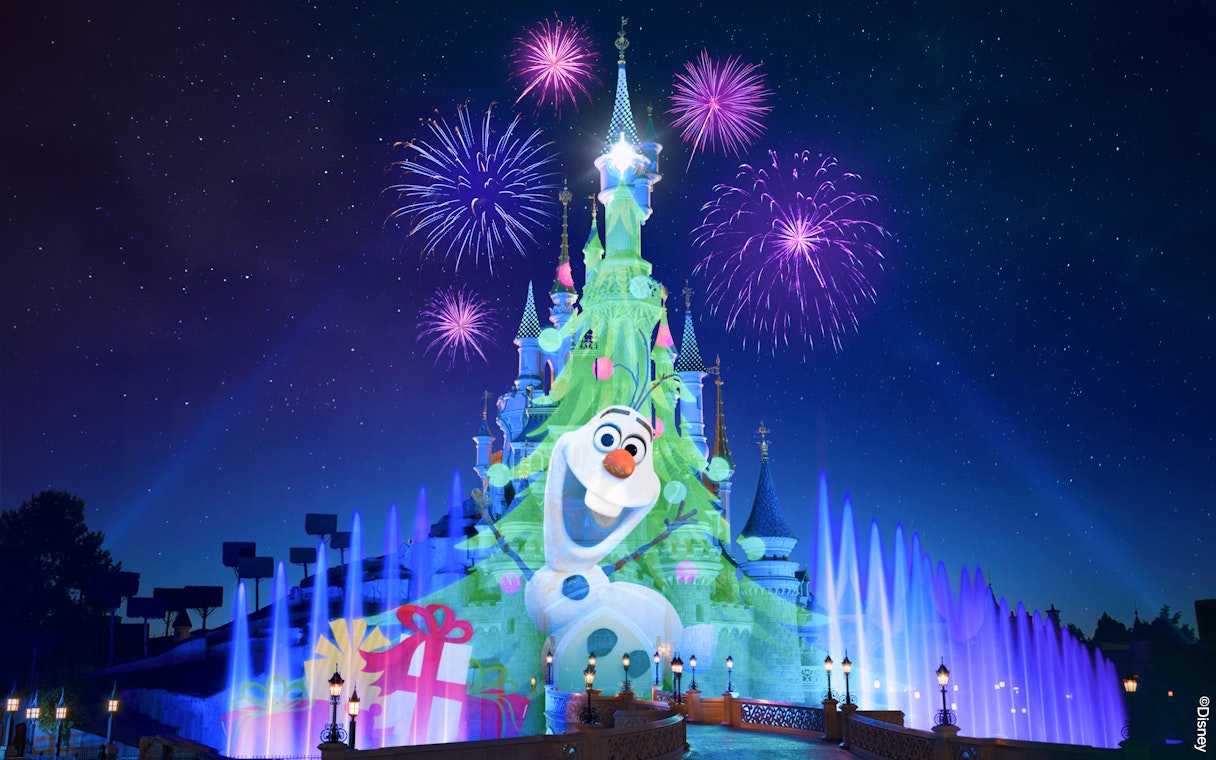 Fireworks over Sleeping Beauty Castle at Disneyland Paris during Christmas.