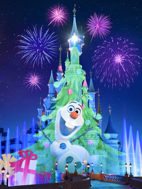 Fireworks over Sleeping Beauty Castle at Disneyland Paris during Christmas.