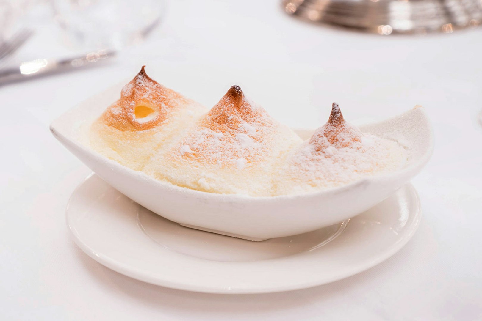 Salzburg dessert Salzburger Nockerl served in a white dish, part of a 3-course dinner.