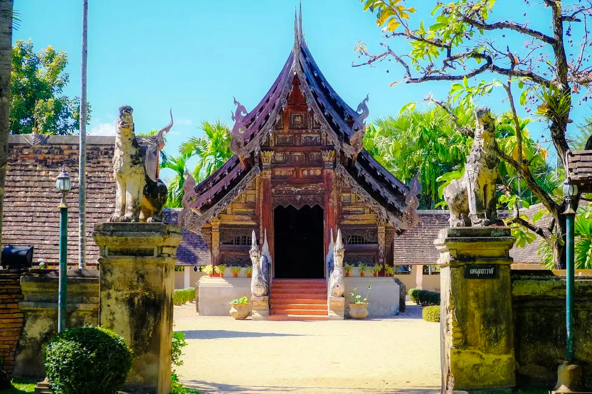 Traditional Thai temple entrance with ornate carvings, Chiang Mai.