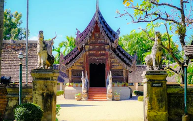Traditional Thai temple entrance with ornate carvings, Chiang Mai.