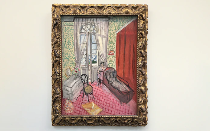 Boudoir painting at Orangerie Museum, Paris, featuring a woman by a window.