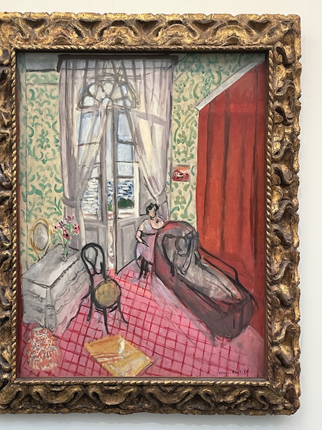 Boudoir painting at Orangerie Museum, Paris, featuring a woman by a window.
