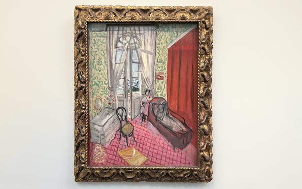 Boudoir painting at Orangerie Museum, Paris, featuring a woman by a window.