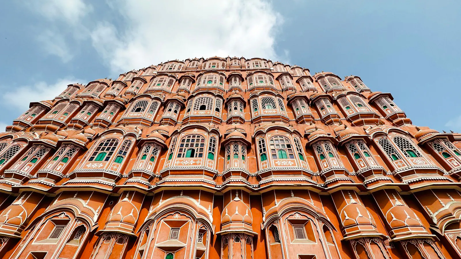 Hawa Mahal facade in Jaipur, India, showcasing intricate windows and architecture.