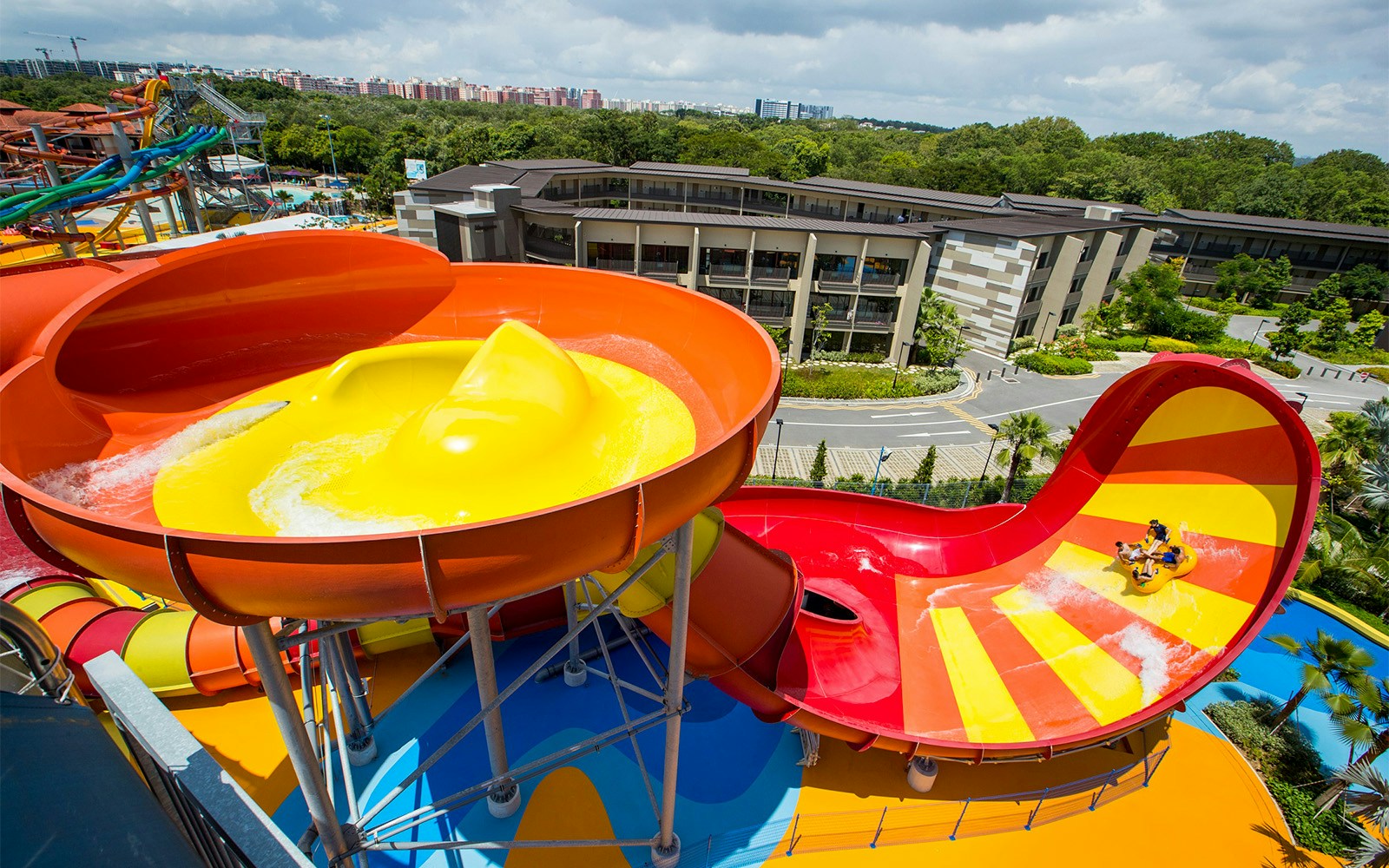 Water slides at Wild Wild Wet Singapore with riders on a raft.