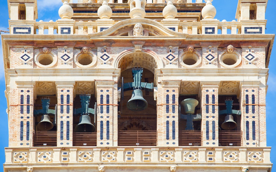 Bells in the belfry section of The Giralda tower, Seville, Spain.