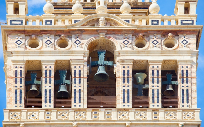 Bells in the belfry section of The Giralda tower, Seville, Spain.
