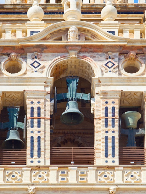 Bells in the belfry section of The Giralda tower, Seville, Spain.
